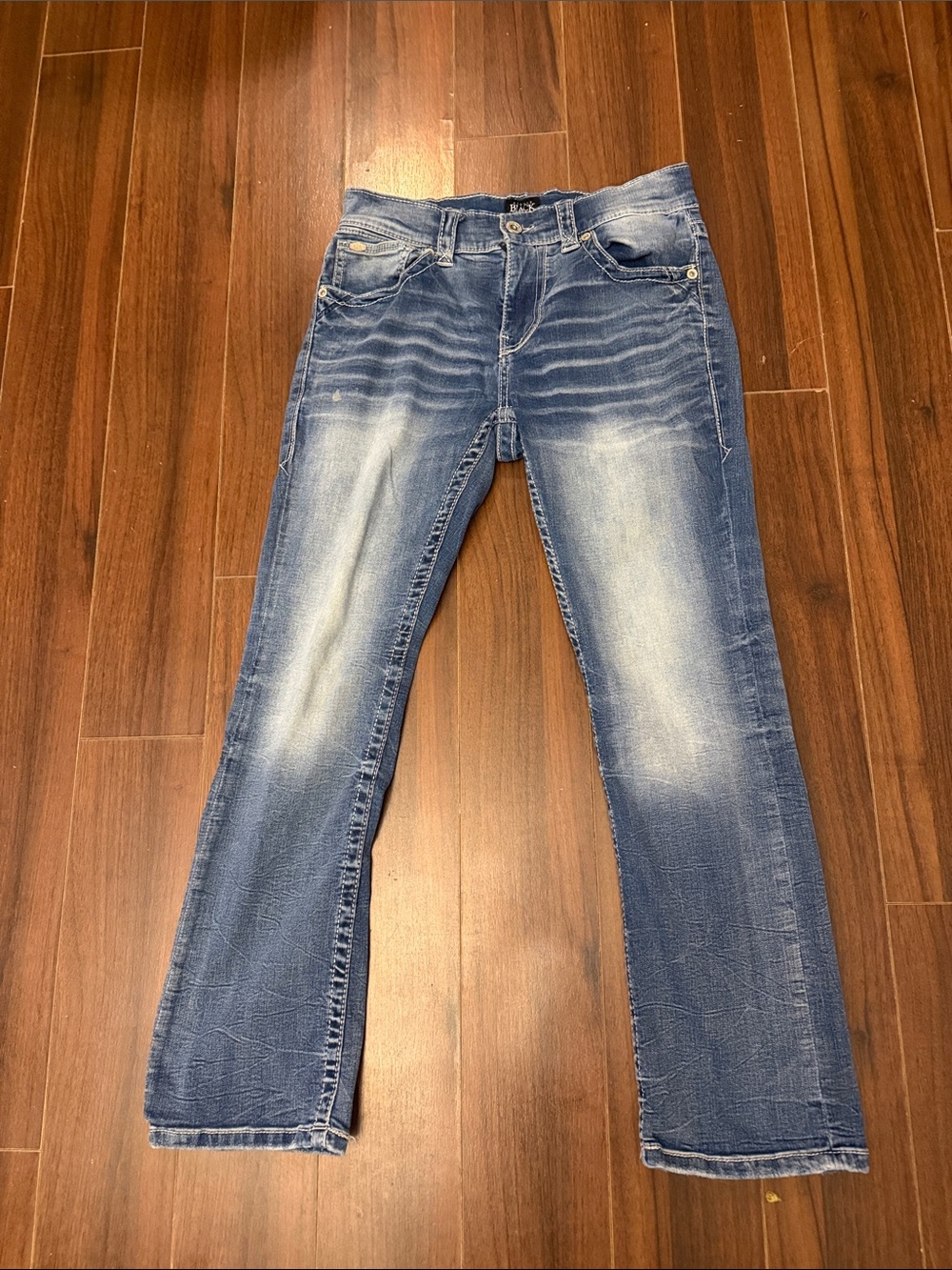 Buckle Men’s Bootcut Jeans in Distressed Blue Wash